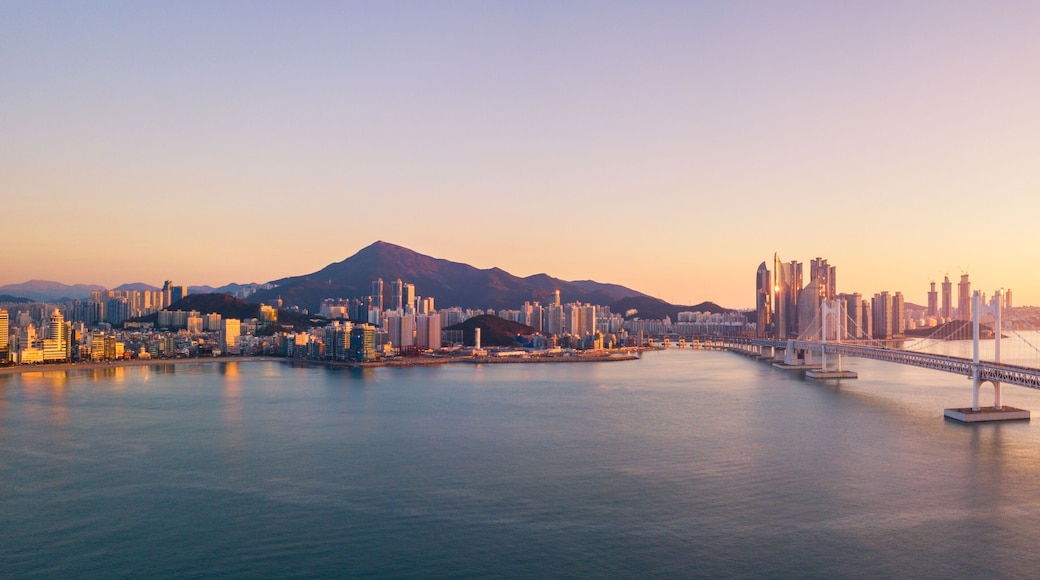 Gwangan Bridge and Haeundae aerial view at Sunrise, Busan, South Korea.