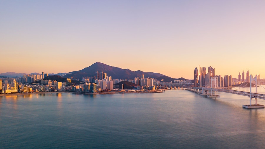 Gwangan Bridge and Haeundae aerial view at Sunrise, Busan, South Korea.