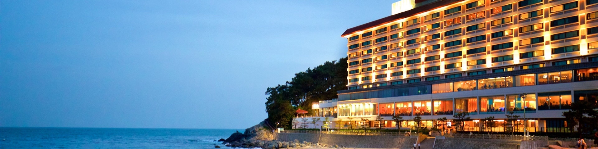 Haeundae Beach which includes a beach, night scenes and general coastal views