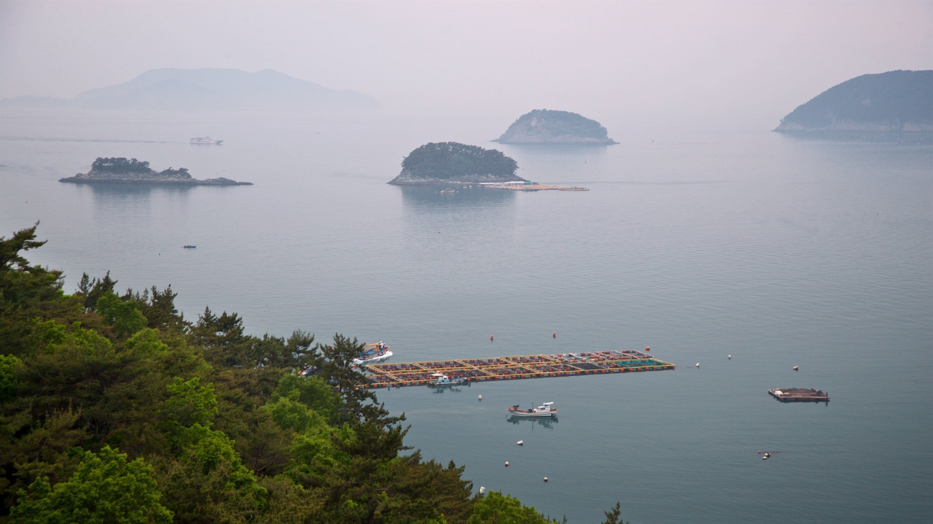 Hallyeo-haesang National Park which includes mist or fog, island views and general coastal views