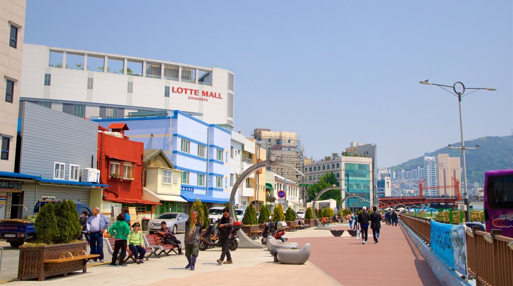 Jagalchi Fish Market featuring a city as well as a small group of people