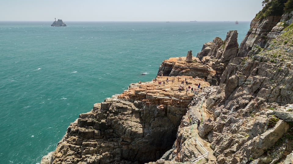 View of Sinseon Rock, rocky and steep cliff and ocean at the Taejongdae Resort Park in Busan, South Korea.