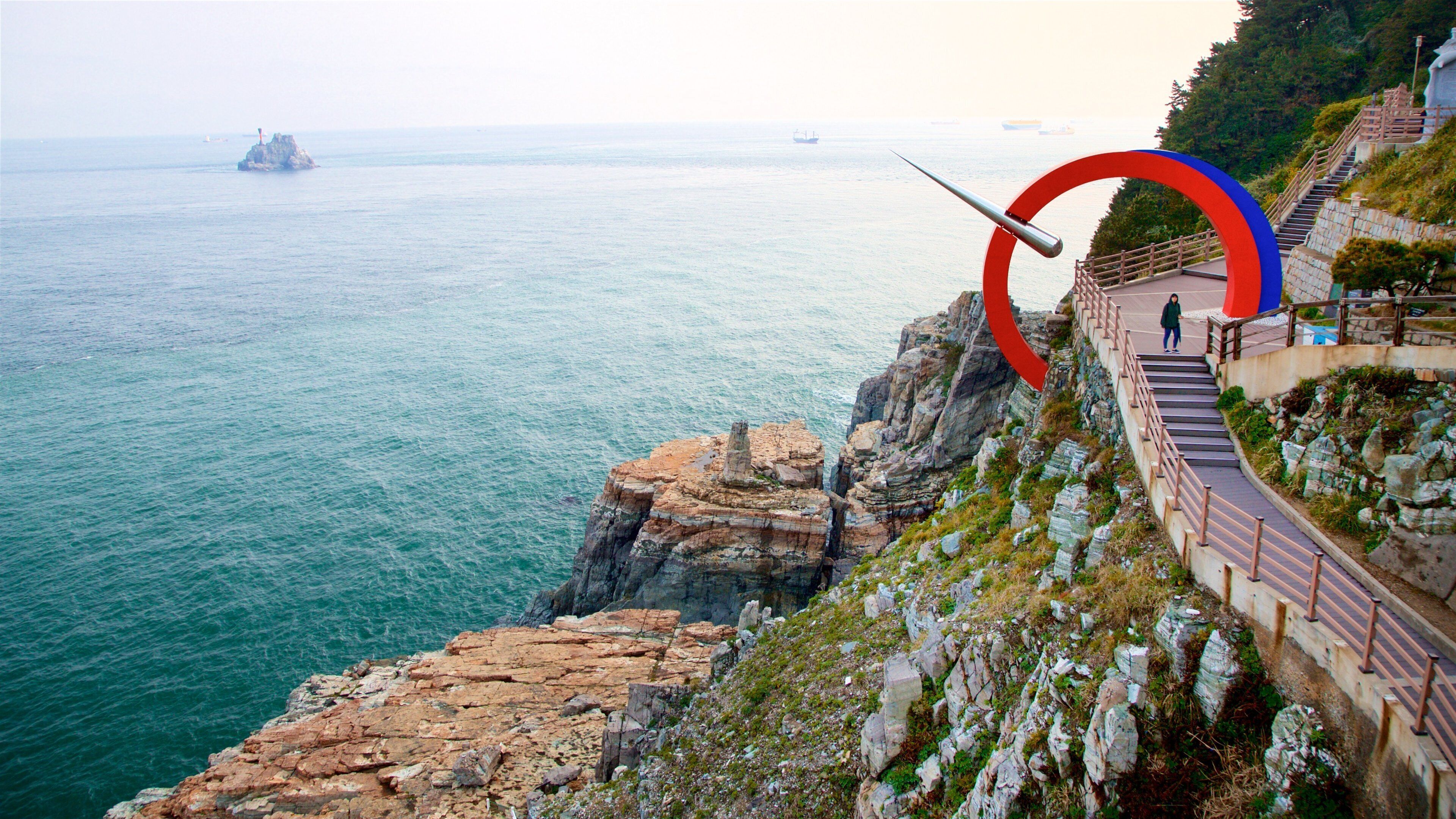 Taejongdae Park which includes island views, outdoor art and general coastal views