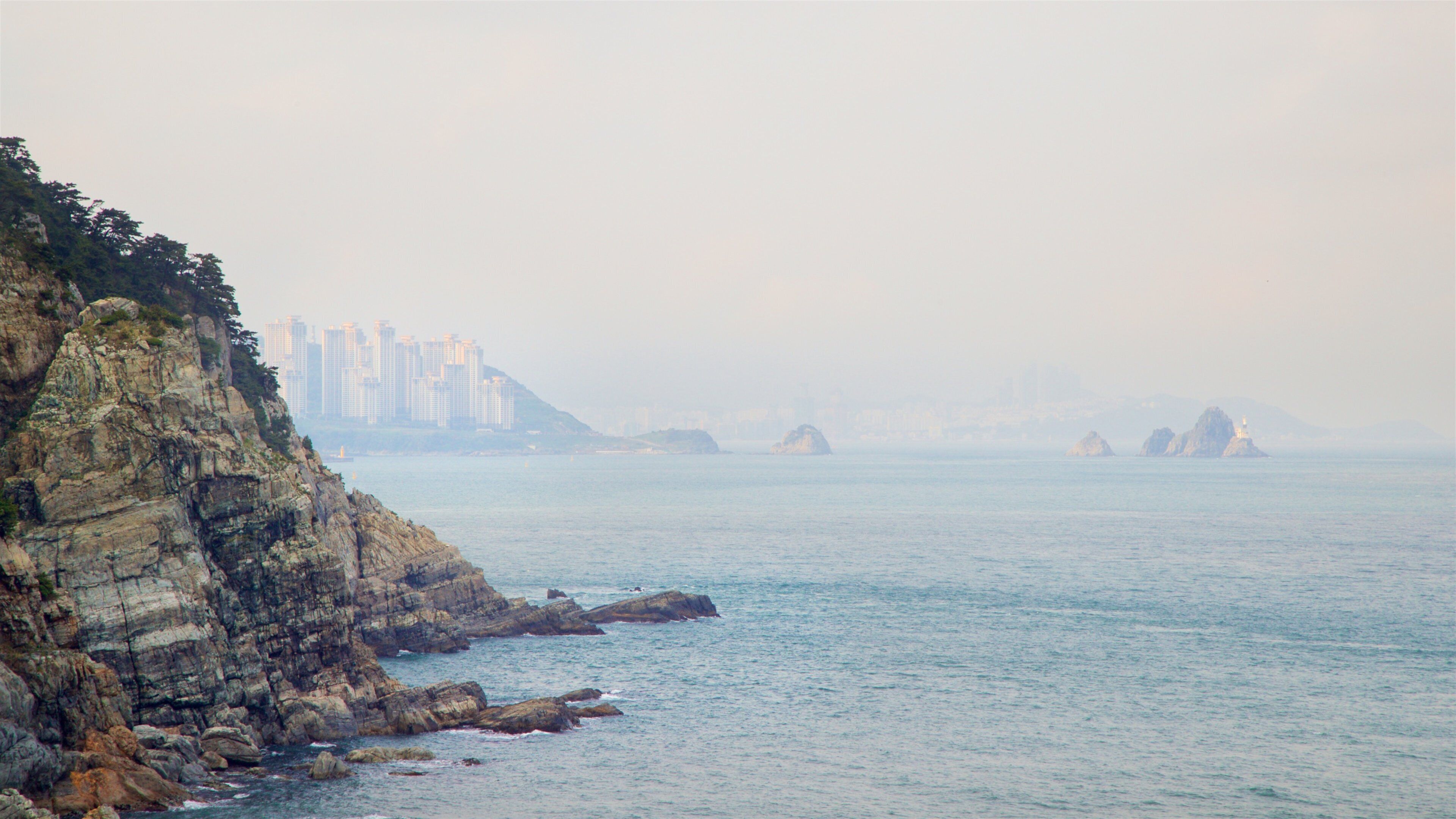 Taejongdae Park showing general coastal views, mist or fog and rugged coastline