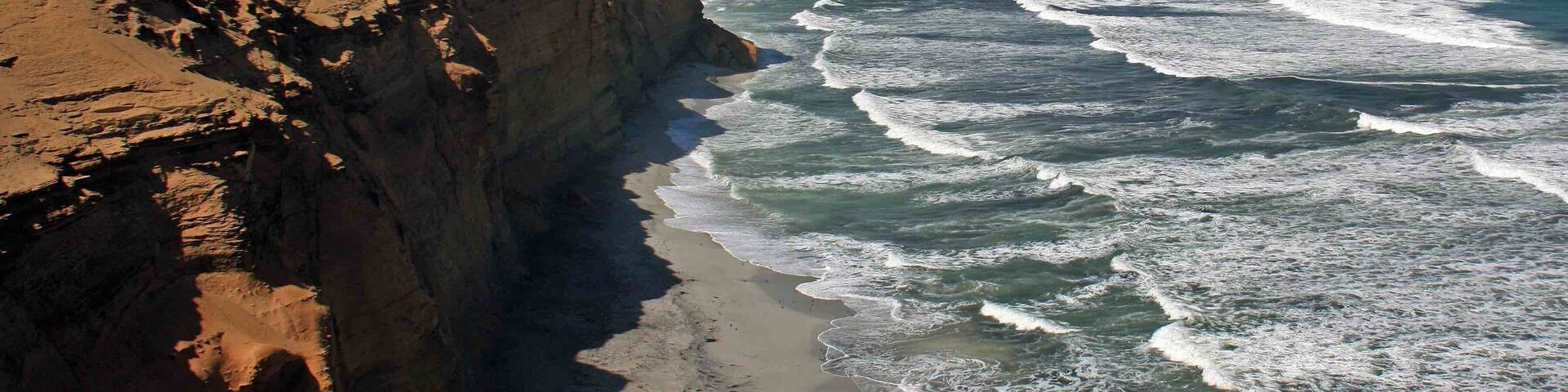 The coastline at the Paracas National Reserve in Peru. This reserve is a great place to see flamingos, sea lions and whales. We also observed several porpoises from the shoreline. There were several places along the shoreline that allow access to the beaches below.