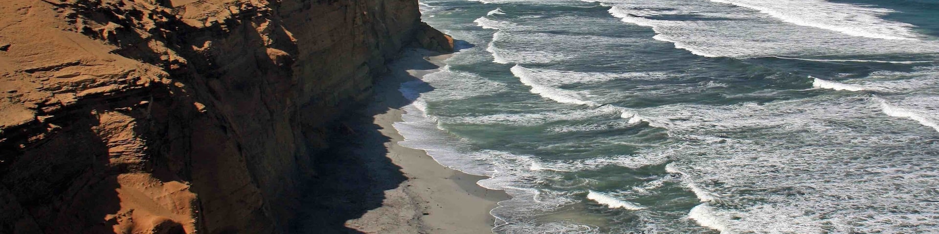 The coastline at the Paracas National Reserve in Peru. This reserve is a great place to see flamingos, sea lions and whales. We also observed several porpoises from the shoreline. There were several places along the shoreline that allow access to the beaches below.