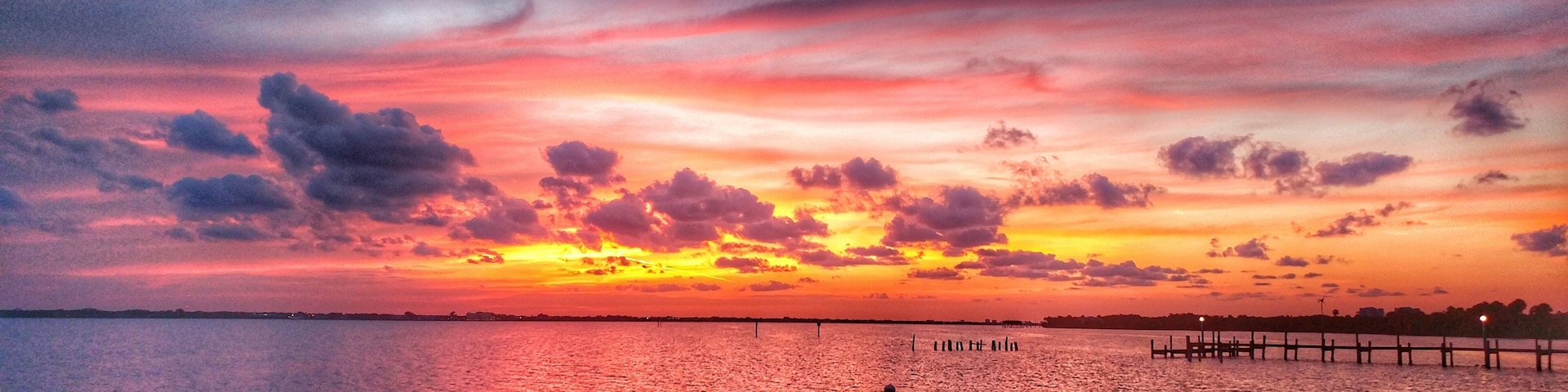 Beautiful sunset with 2 manatees sticking up their big snouts. Manatees are not visible in this picture.