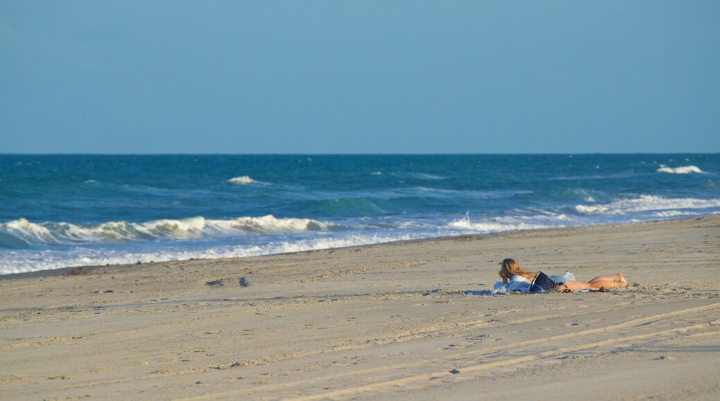 Melbourne Beach which includes general coastal views and a beach as well as a couple