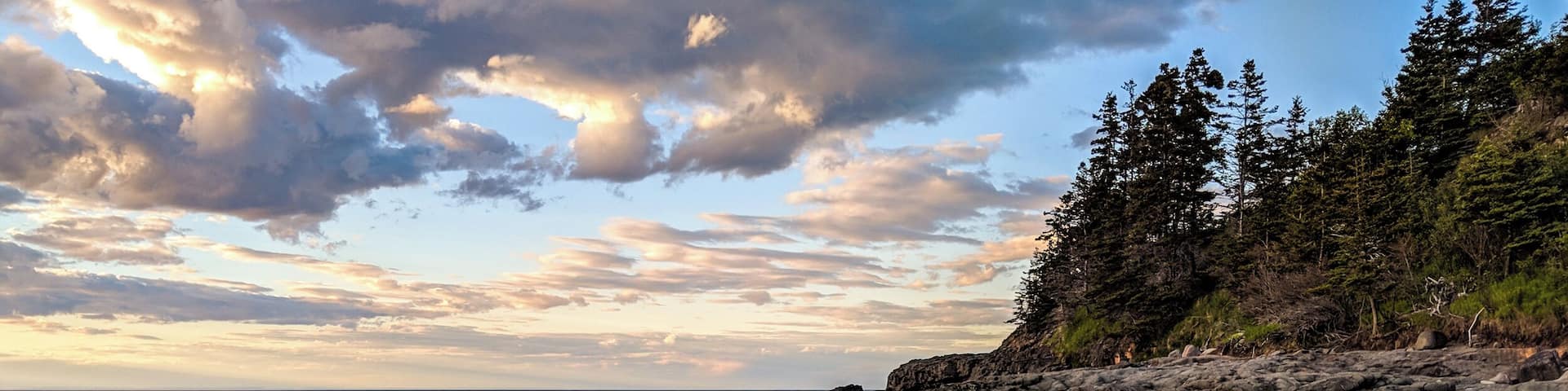 Right next to a little wharf in Granville ferry. Beautiful little rocky beach. Be careful to not slip as the rock are easily disturbed.