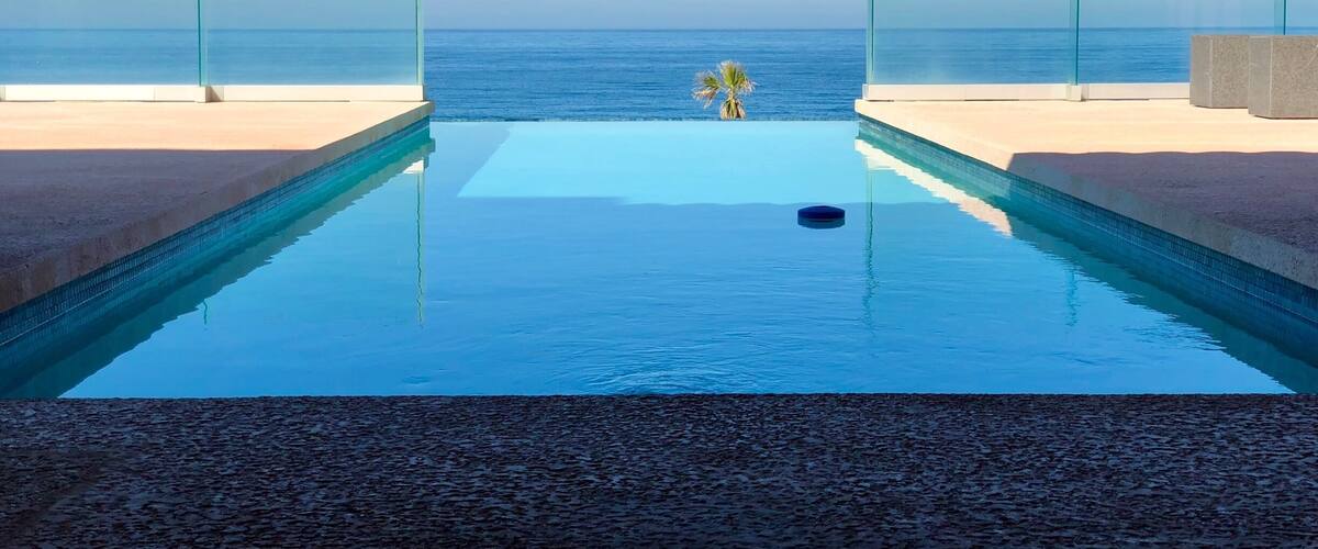 A infinity pool with a view of the ocean.