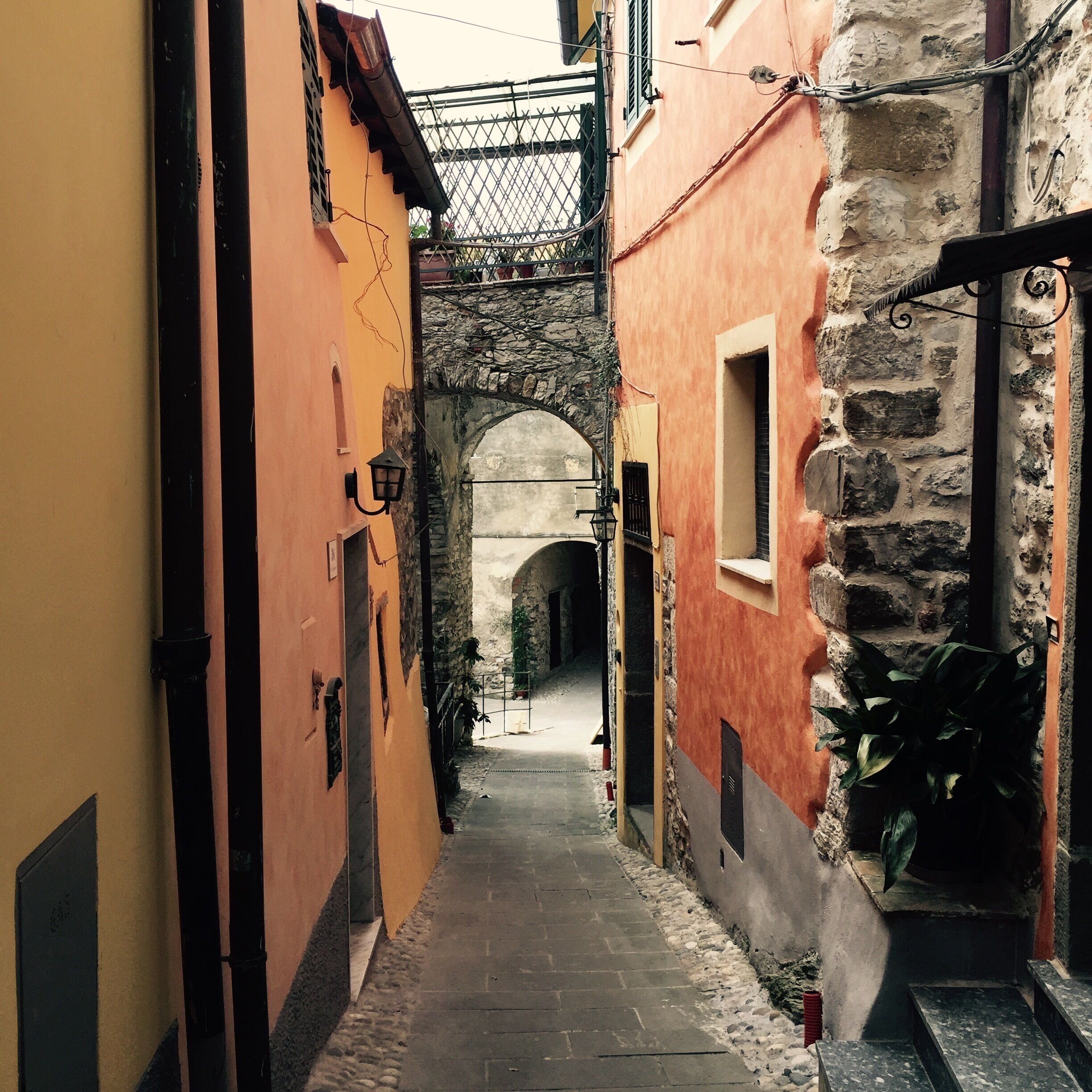 Pretty picturesque village sprawling down a hillside.  Lots of narrow streets with pretty pastel hued houses and quite a few cats!  