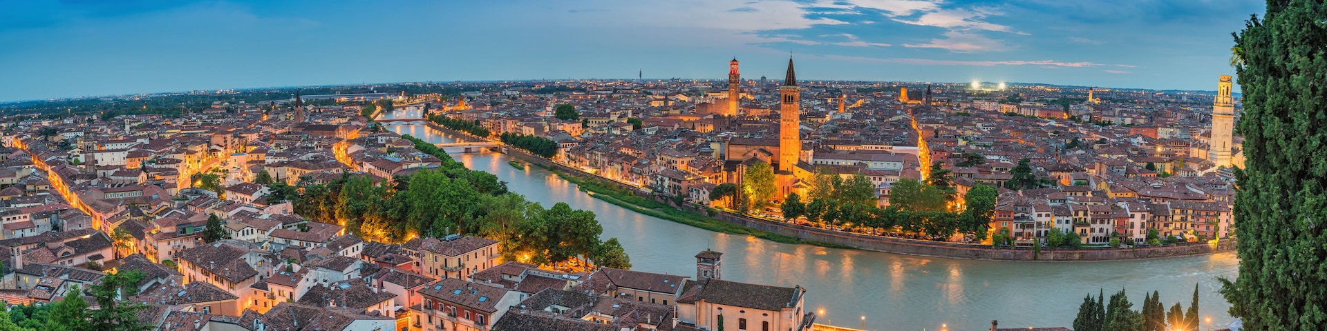 Verona Italy, high angle view panorama night city skyline at Adige river