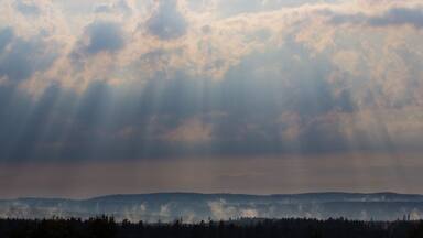 Sun breaking through the clouds after a thunder storm.