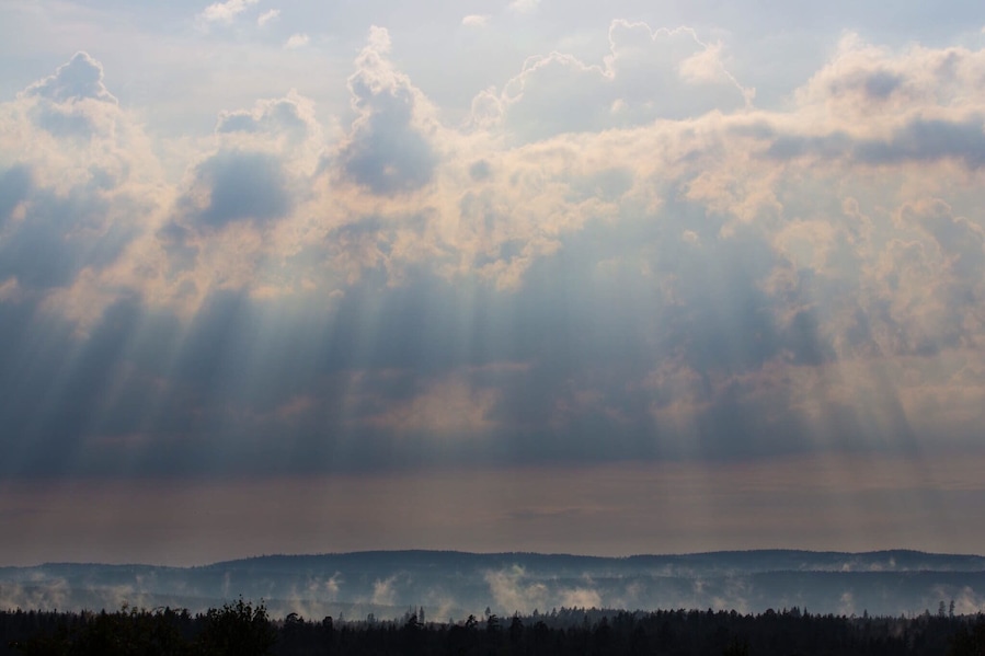 Sun breaking through the clouds after a thunder storm.