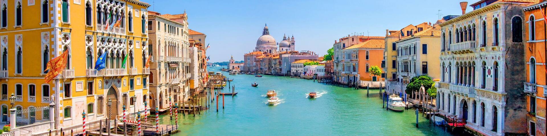 Panorama of Grand Canal and Basilica Santa Maria della Salute in Venice, Italy. Architecture and landmarks of Venice and Italy. Beautiful landscape of Grand Canal in Venice, Italy