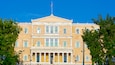 Syntagma Square which includes a city, street scenes and an administrative buidling
