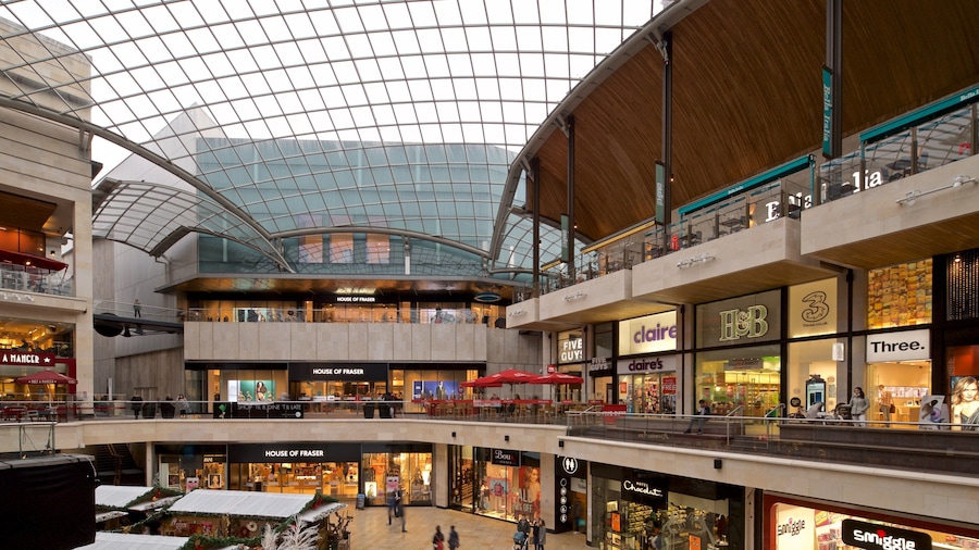 A multi-level shopping mall with various stores including House of Fraser, Claire's, and H&M.