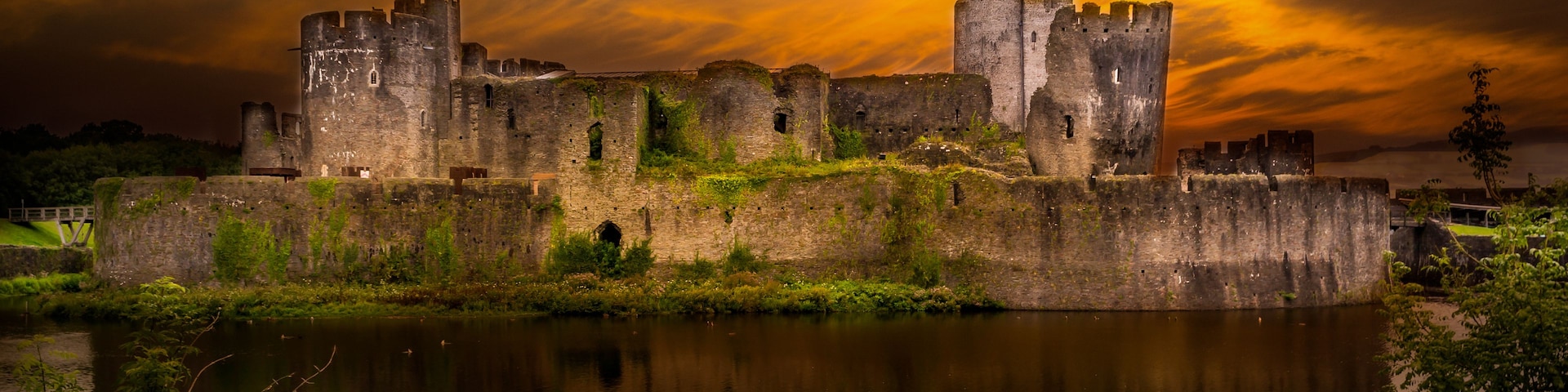 A medieval castle with multiple towers and a moat.