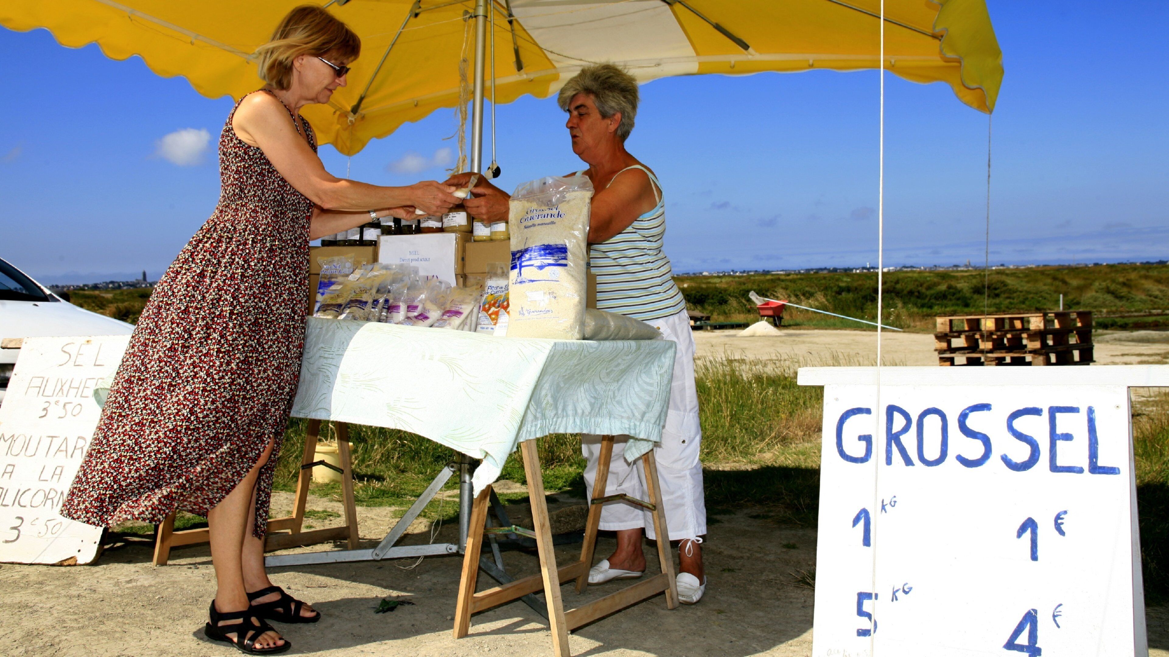 Guerande which includes markets as well as a small group of people