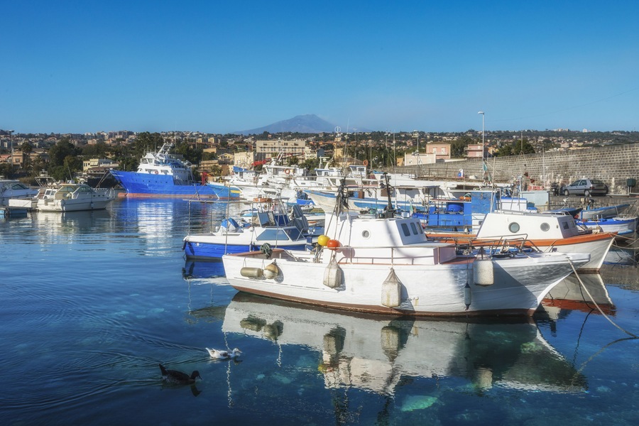 The harbor of Riposto. volcano Etna in the background. Catania, Sicily