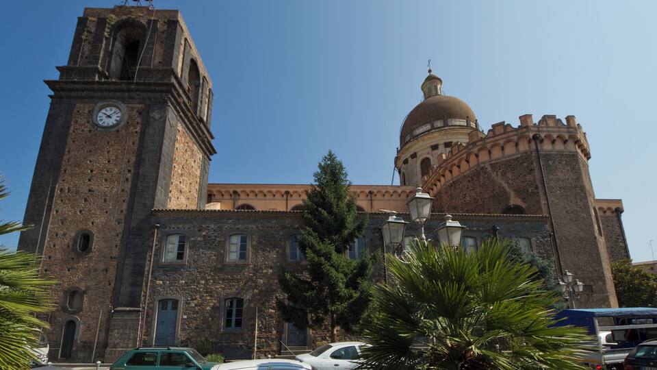 A historic building with a clock tower and a dome.