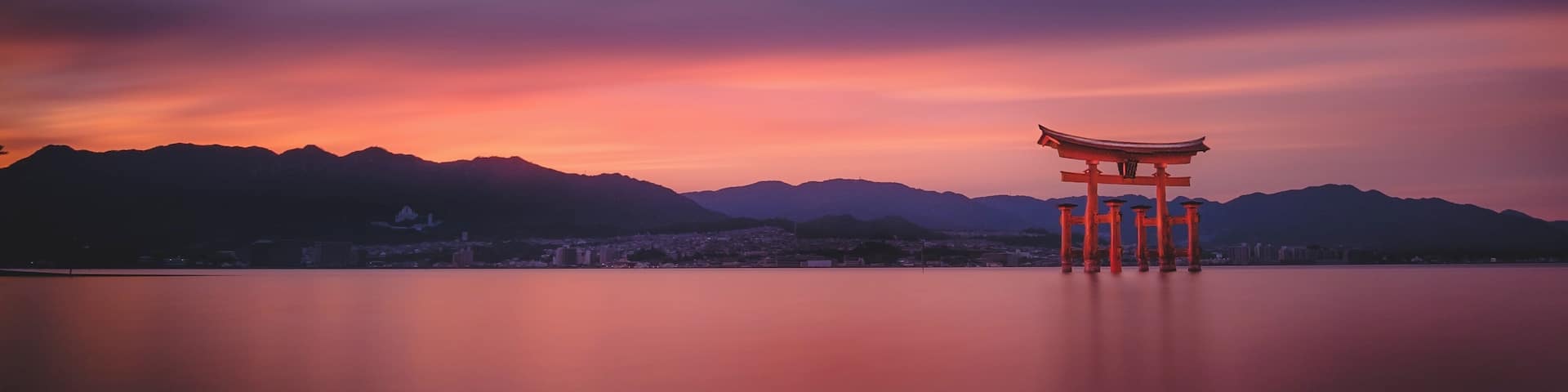 A photograph of the famous Tori gate in the water on Miyajima Island.
Very easy access to the beach - just watch out for the deer. While I was taking this picture a deer was going through my camera bag and heading off down the beach with one of my filter holders. A fantastic island for photographers and tourists in general and well worth an overnight visit if you're going to Hiroshima, as it's only an hour away, and free to get to if you're on a JR rail pass.