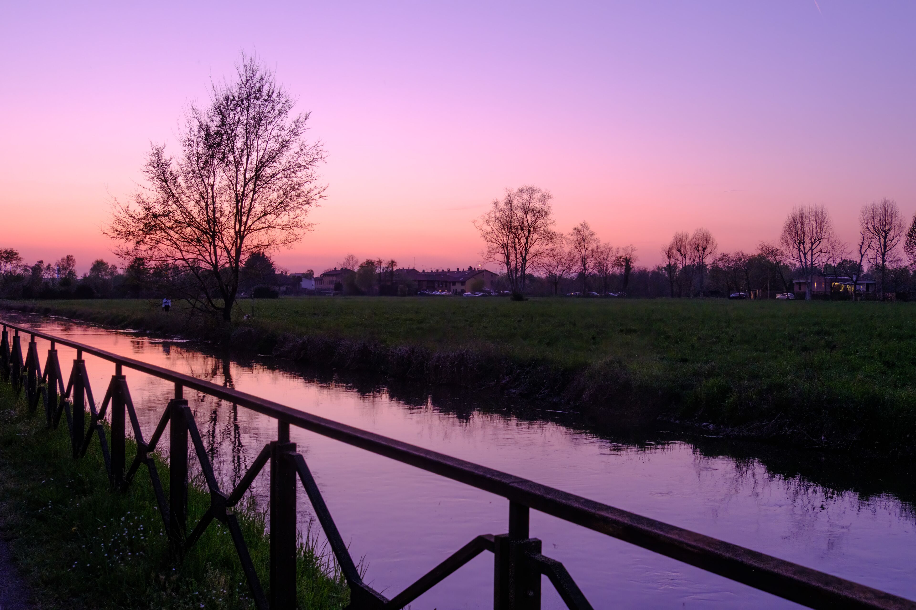 Country landscape along the Canal of Martesana, Milan, Italy, at sunset