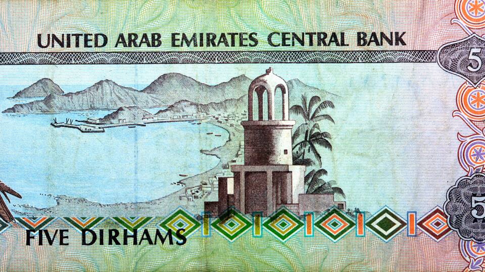 Reverse side of 5 five Emirates Dirhams banknote of the United Arab Emirates, currency of the UAE issued 1982 with Imam Salem Al Mutawa Mosque or Al Jamaa mosque in Sharjah, Khor Fakkan and a falcon