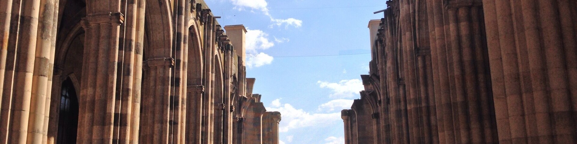 A cathedral with tall, arched windows and columns.