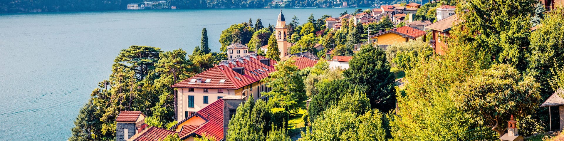 Laglio town is a small ton on the Como lake, Province of Como, Lombardy region, Italy, Europe. Summy summer view of with S.Giorgio church. Traveling concept background.