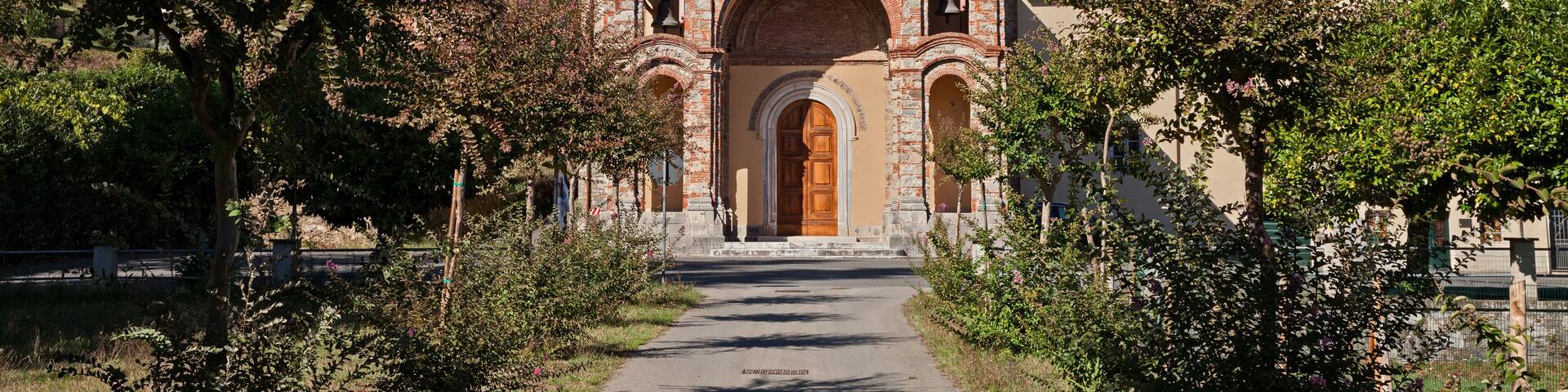 Pescaglia, Lucca, Tuscany, Italy: the catholic church of San Martino In Freddana in eclectic style with the ancient bell tower of romanesque architecture