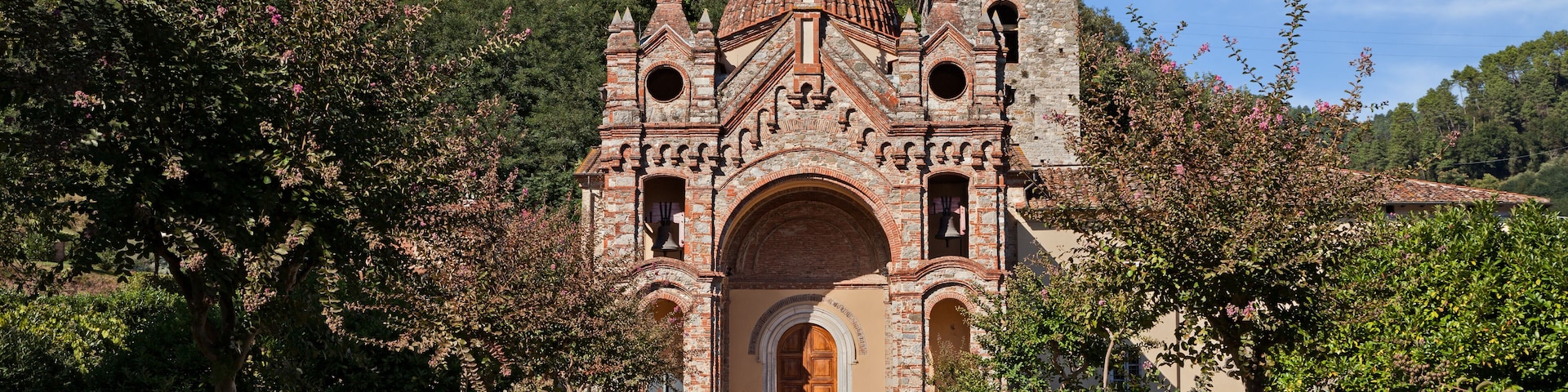 Pescaglia, Lucca, Tuscany, Italy: the catholic church of San Martino In Freddana in eclectic style with the ancient bell tower of romanesque architecture