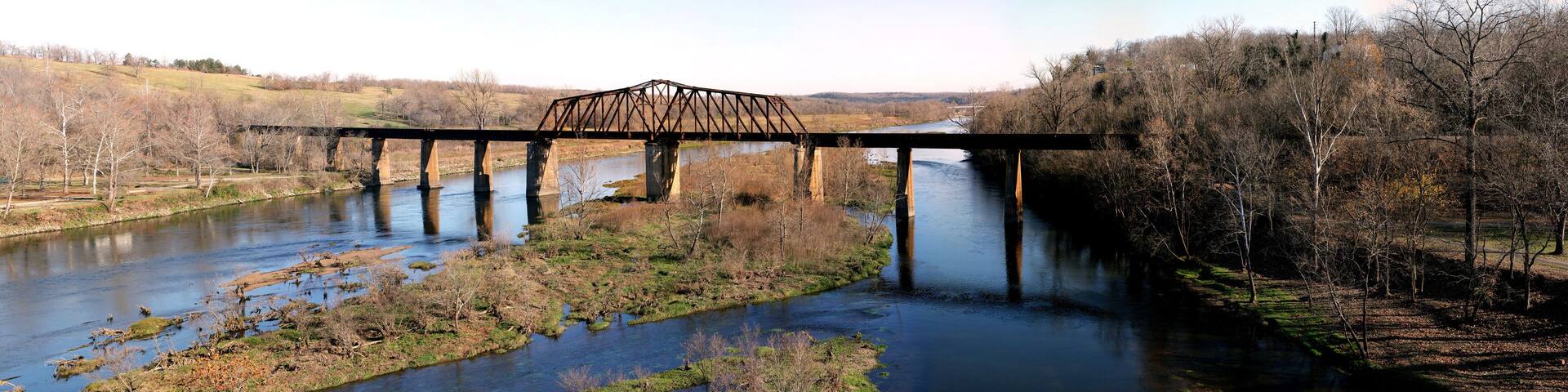 Historic iron swing bridge over the White River, near Cotter Arkansas. Old steel truss bridge built in 1905, stretches 285 feet long.