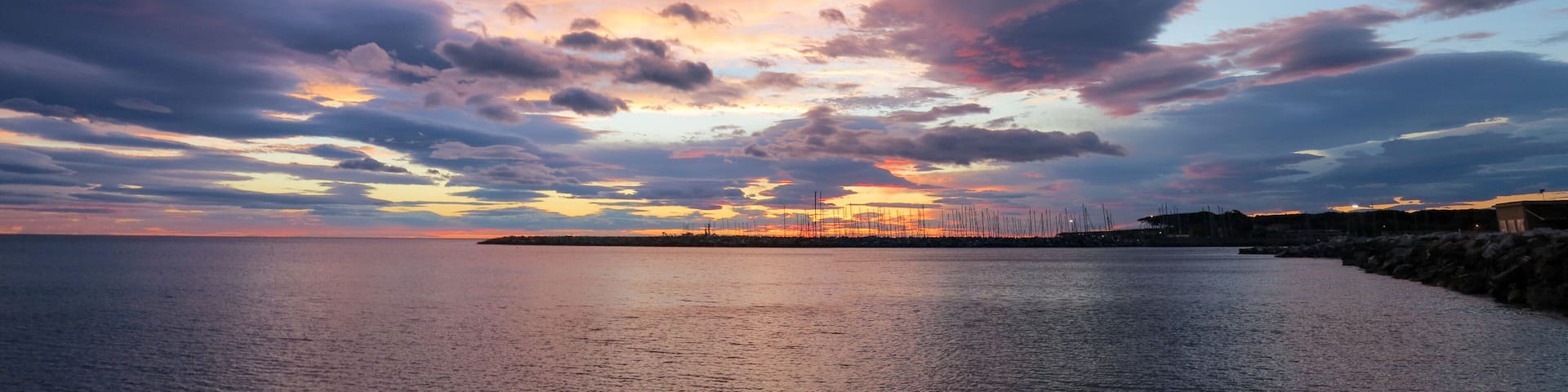 sunset over the port of Cecina.