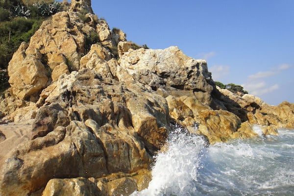 When we were in our hostel (I always use HelloBCN) we asked for a beach recommendation that was outside of Barcelona.
But you take a train and get off at the stop "Sant Pol de Mar" and it is where the locals swim. It is where the staff at the hostel go to swim. Taking the extra hour to get there will be great. We also went on an impromptu hike and the result, amazing photos.