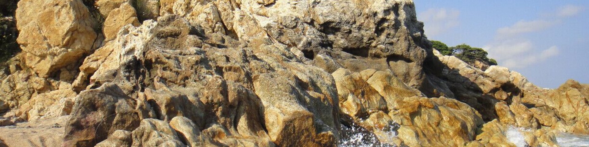 When we were in our hostel (I always use HelloBCN) we asked for a beach recommendation that was outside of Barcelona.
But you take a train and get off at the stop "Sant Pol de Mar" and it is where the locals swim. It is where the staff at the hostel go to swim. Taking the extra hour to get there will be great. We also went on an impromptu hike and the result, amazing photos.