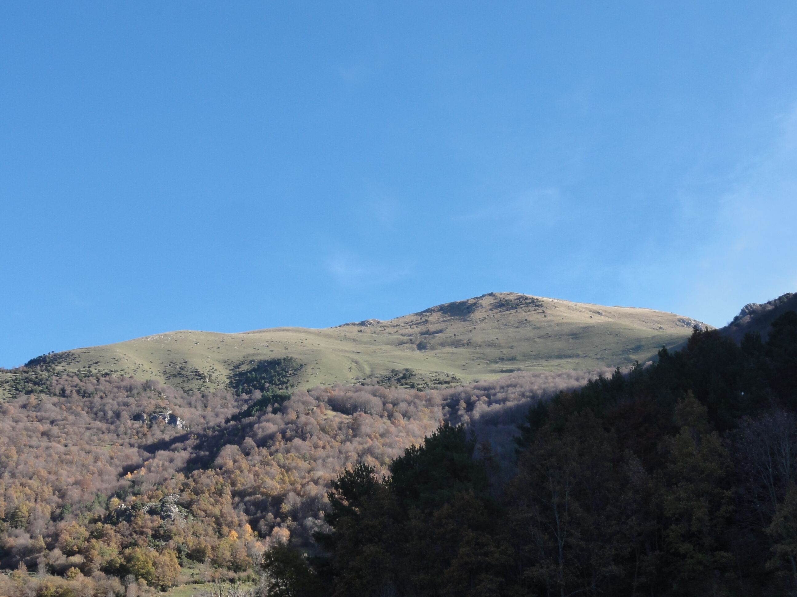 A mountain with a clear sky.