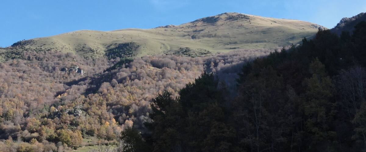 A mountain with a clear sky.