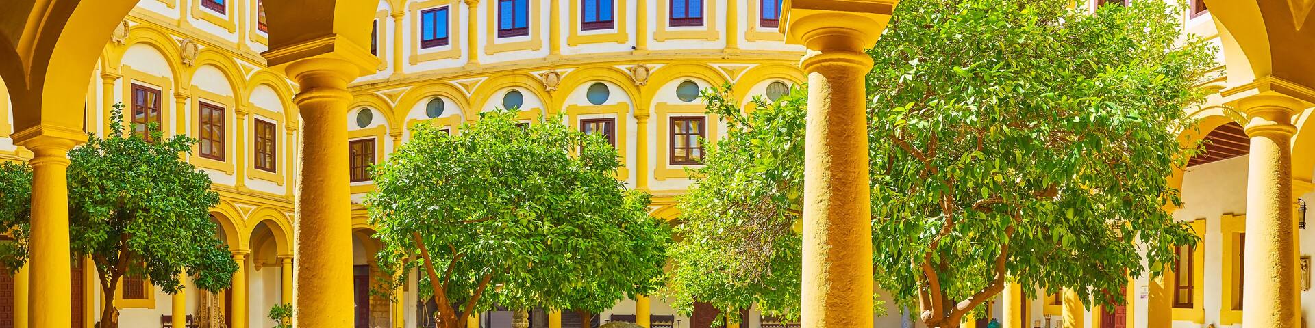 Panorama of the courtyard of Episcopal Palace with orange tree garden, Cordoba, Spain