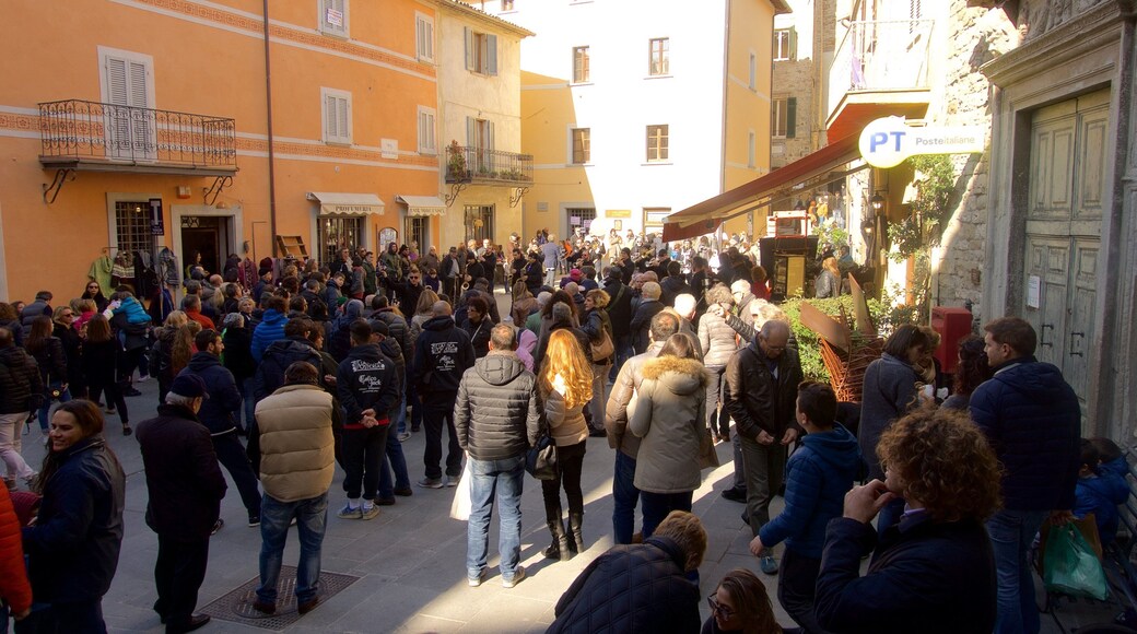 Montone featuring street scenes as well as a large group of people