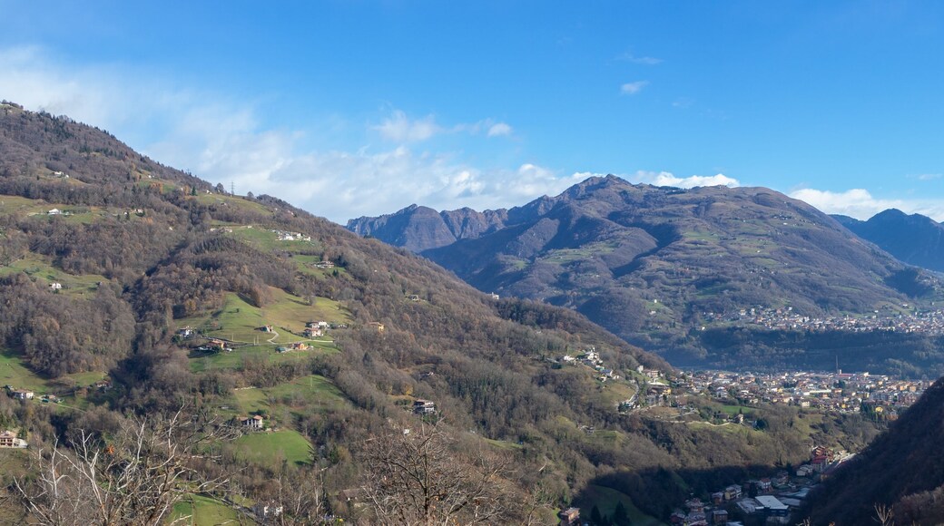 Drone aerial view to the Seriana and Gandino valley in fall season. Landscape from the village of Orezzo, Bergamo, Italy