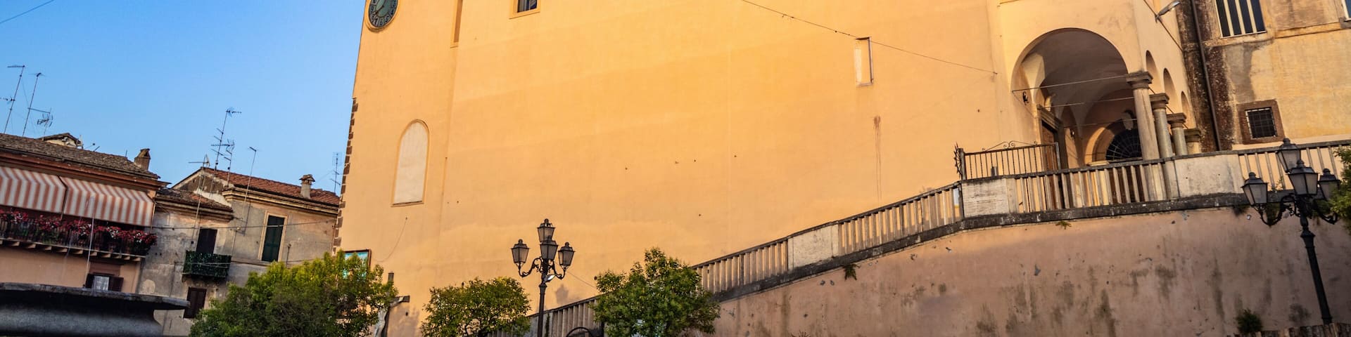 The Convent of S. Maria delle Grazie, in Santa Maria square. The bell tower with the clock. The blue sky at sunset. Zagarolo, Province of Rome, Lazio, Italy