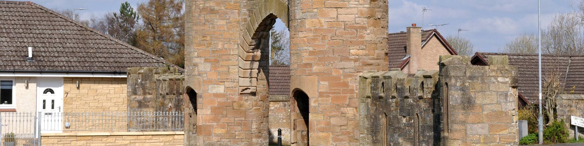 Derelict Castellated Stone Entrance and Towers to Old Disused Park
