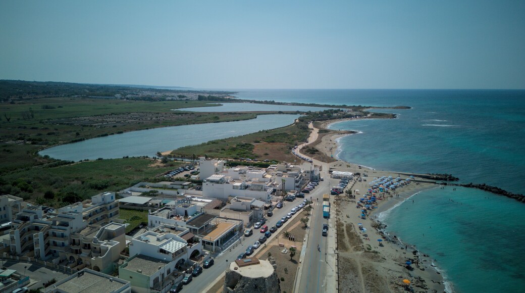 Torre Mozza is a coastal town in Salento, Puglia, known for its white sandy beaches and crystal-clear waters. The 17th-century tower, from which it takes its name, overlooks the scenic coastline