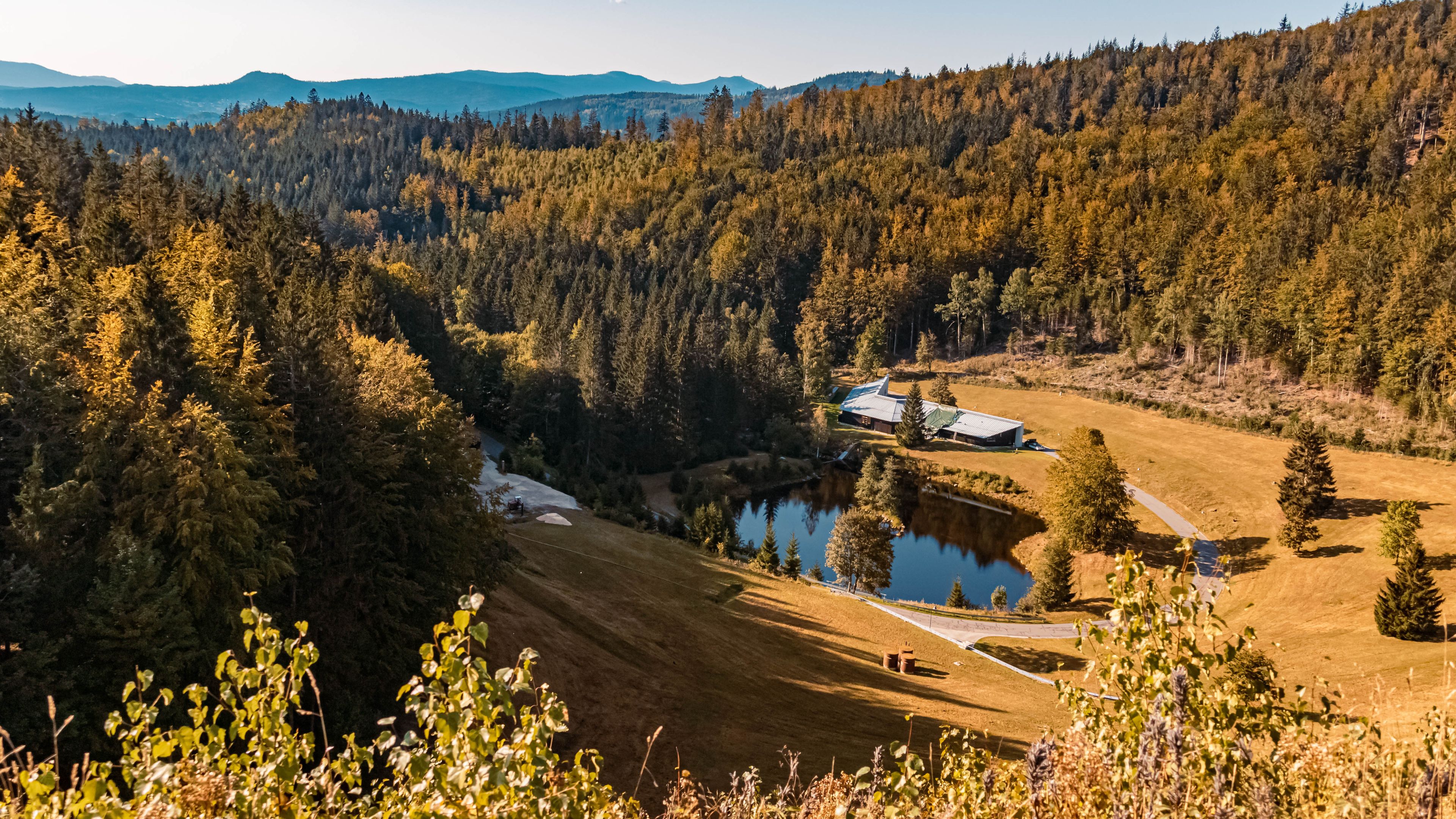 Beautiful autumn or indian summer view with reflections at the famous drinking water reservoir Frauenau, Bavarian forest, Bavaria, Germany