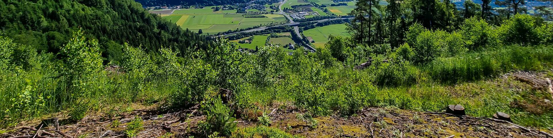 A panoramic view on the Karawanks in Carinhia, Austrian Alps. The mountains in the back are very steep and sharp. The view can be seen from Oswaldiberg, Villach. Clear and blue sky. Serenity