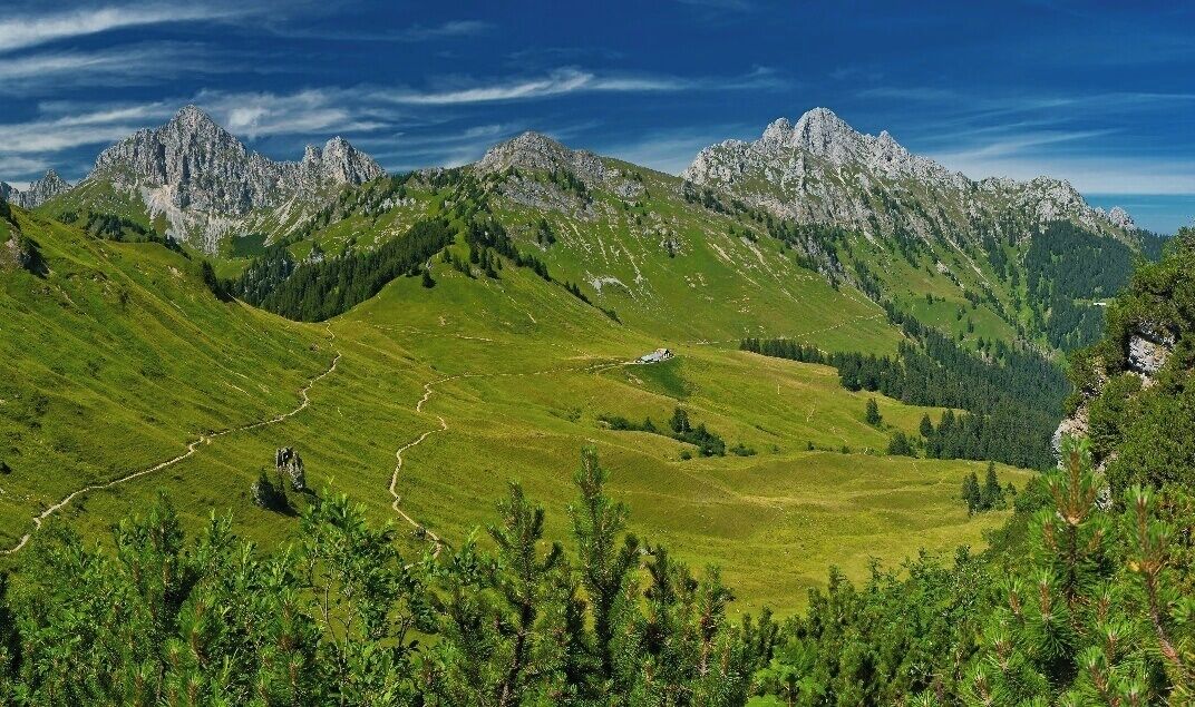 July 2015

Tannheimer Berge 

Koellenspitze (2.238 m) , Schneid (2.009 m) and Gehrenspitze (2.163 m) as seen from the route to Hahnenkamm from the cable car station near Reutte in Tyrolian Austria. 
These summits belong to Tannheimer Berge (mountains) which are part of the Allgaeuer Alps. 