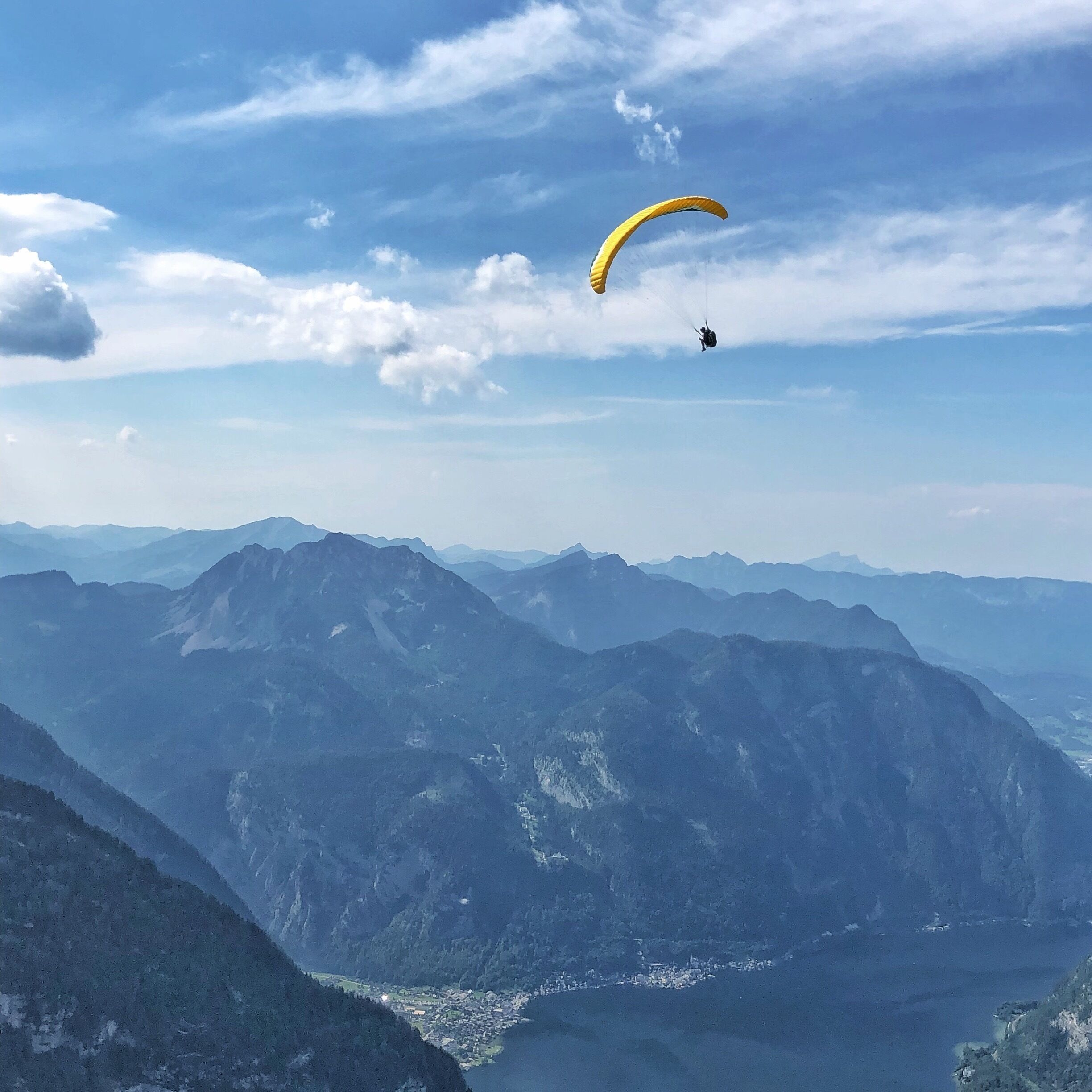 High above Hallstatt
A paraglider soaring the thermals over Hallstatt way, way below. Taken with my phone at Five Fingers