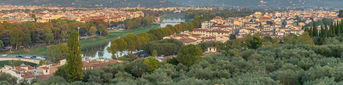 Scenic view of the sunset over Florence and the Tuscan countryside from the top of a hill.
