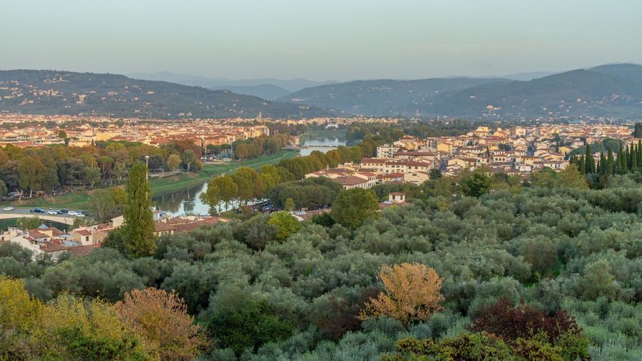Scenic view of the sunset over Florence and the Tuscan countryside from the top of a hill.